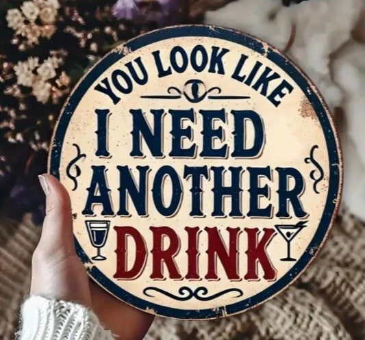 You Look Like I Need Another Drink Funny Round Aluminum Sign — product artwork